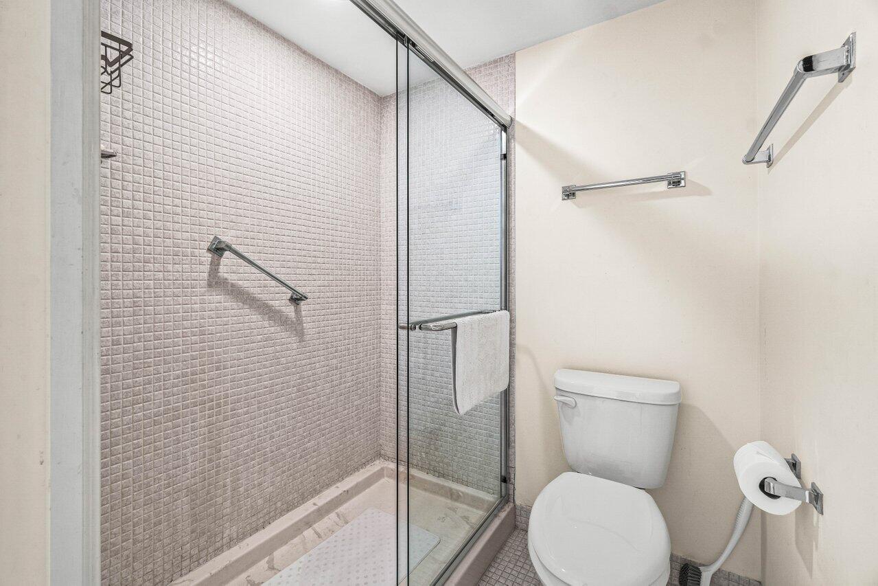 2000 South Ocean Boulevard, Unit 306 Delray Beach, FL 33483 - Photo 25 of 42 a bathroom with a toilet and a shower