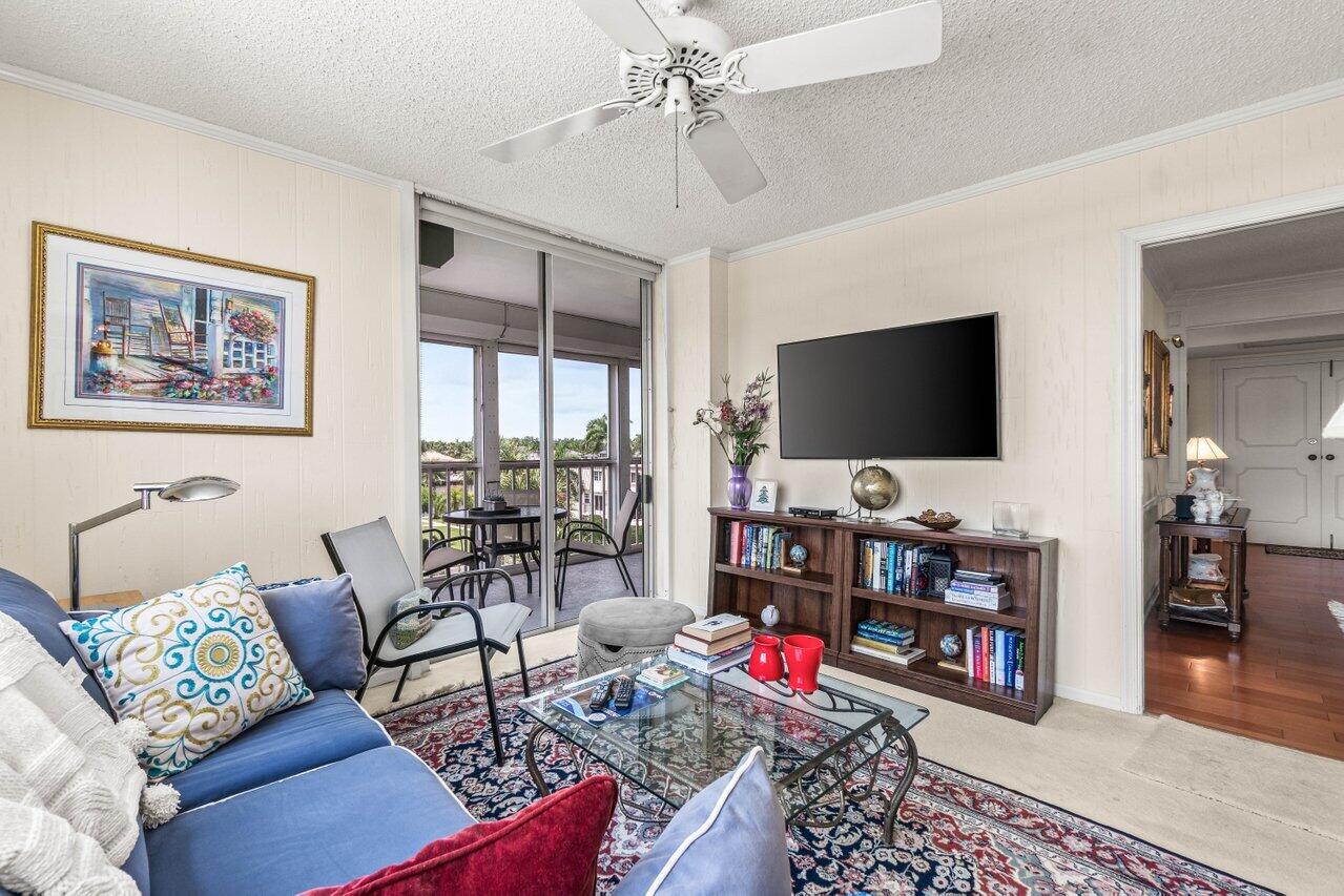 2000 South Ocean Boulevard, Unit 306 Delray Beach, FL 33483 - Photo 28 of 42 a living room with furniture and a flat screen tv