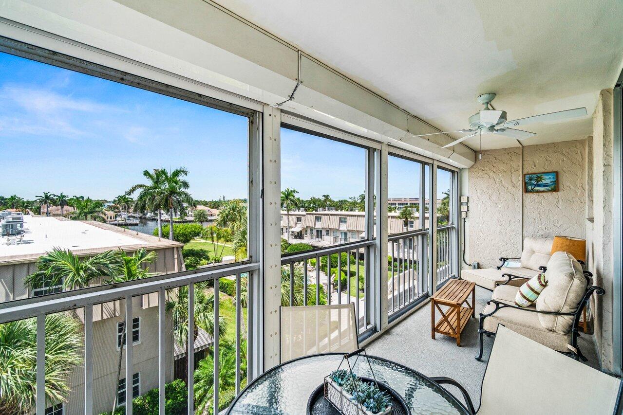 2000 South Ocean Boulevard, Unit 306 Delray Beach, FL 33483 - Photo 30 of 42 a balcony view with a large window and furniture
