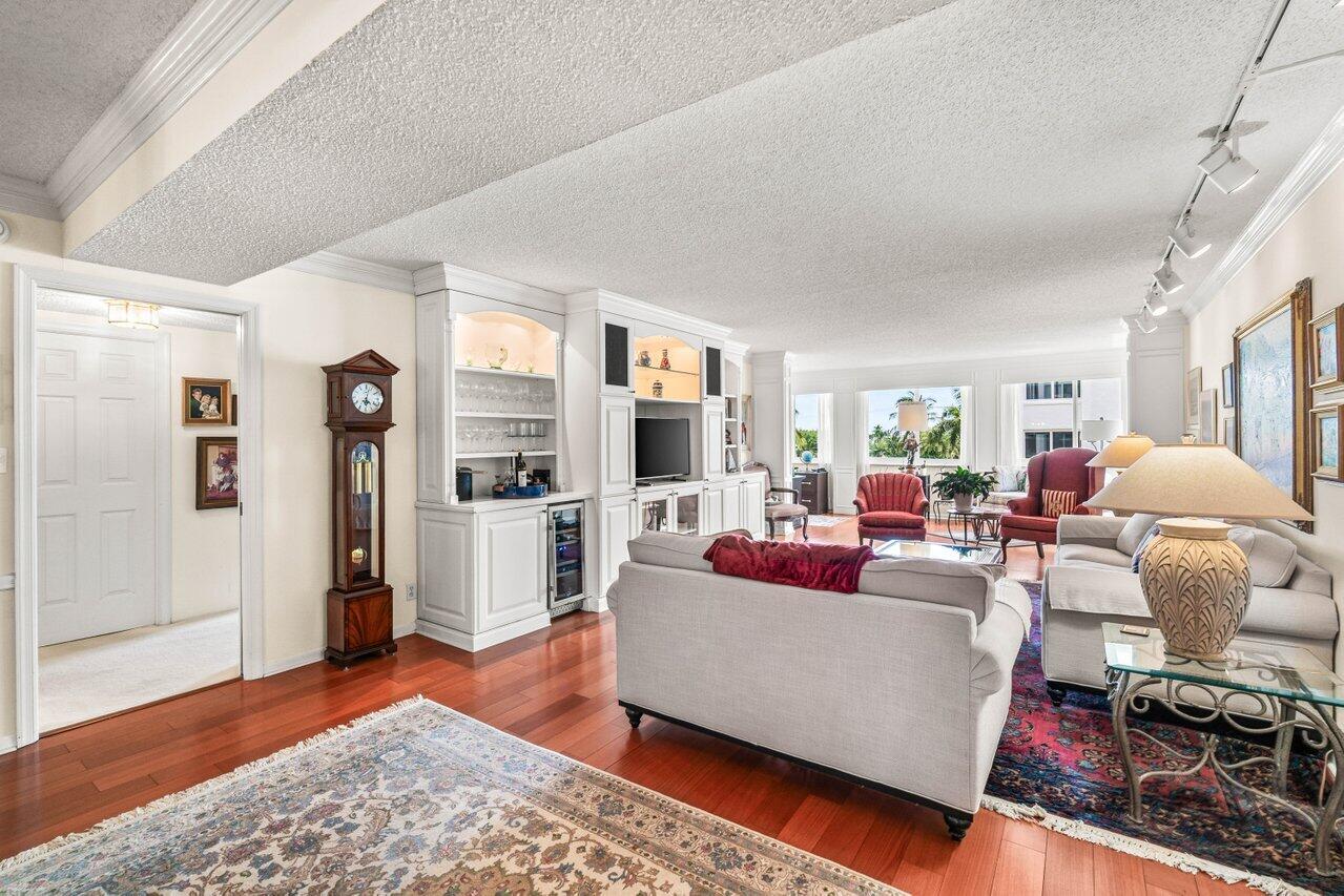 2000 South Ocean Boulevard, Unit 306 Delray Beach, FL 33483 - Photo 3 of 42 a living room with furniture and a rug
