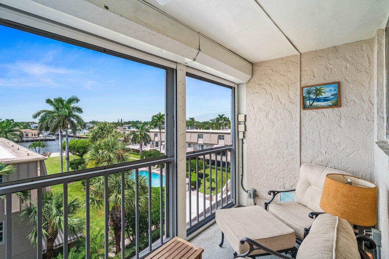 2000 South Ocean Boulevard, Unit 306 Delray Beach, FL 33483 - Photo 32 of 42 a view of a balcony with chairs and a potted plant