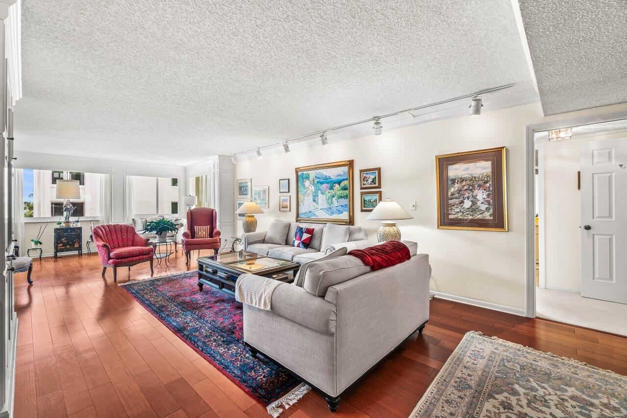 2000 South Ocean Boulevard, Unit 306 Delray Beach, FL 33483 - Photo 4 of 42 a living room with furniture and wooden floor