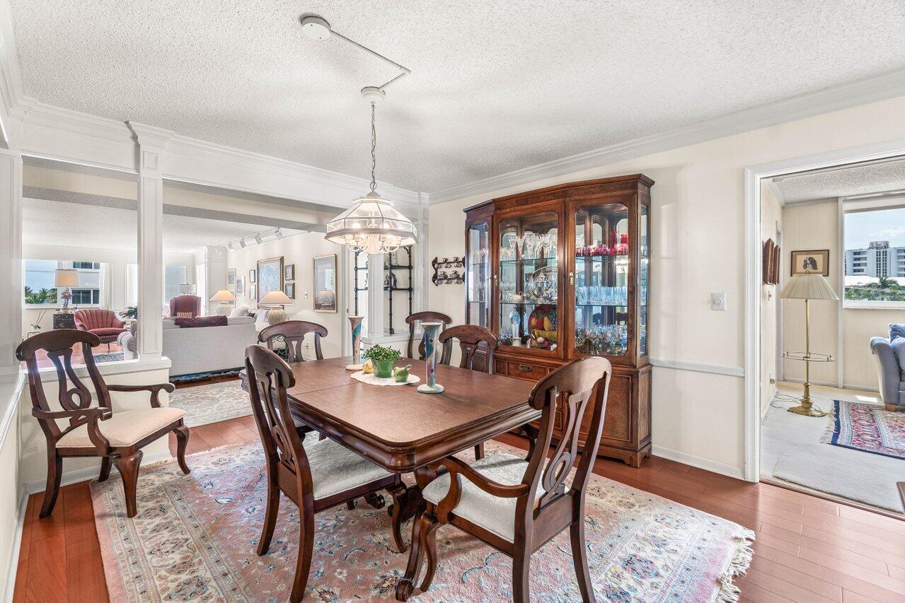 2000 South Ocean Boulevard, Unit 306 Delray Beach, FL 33483 - Photo 9 of 42 a view of a dining room with furniture window and wooden floor