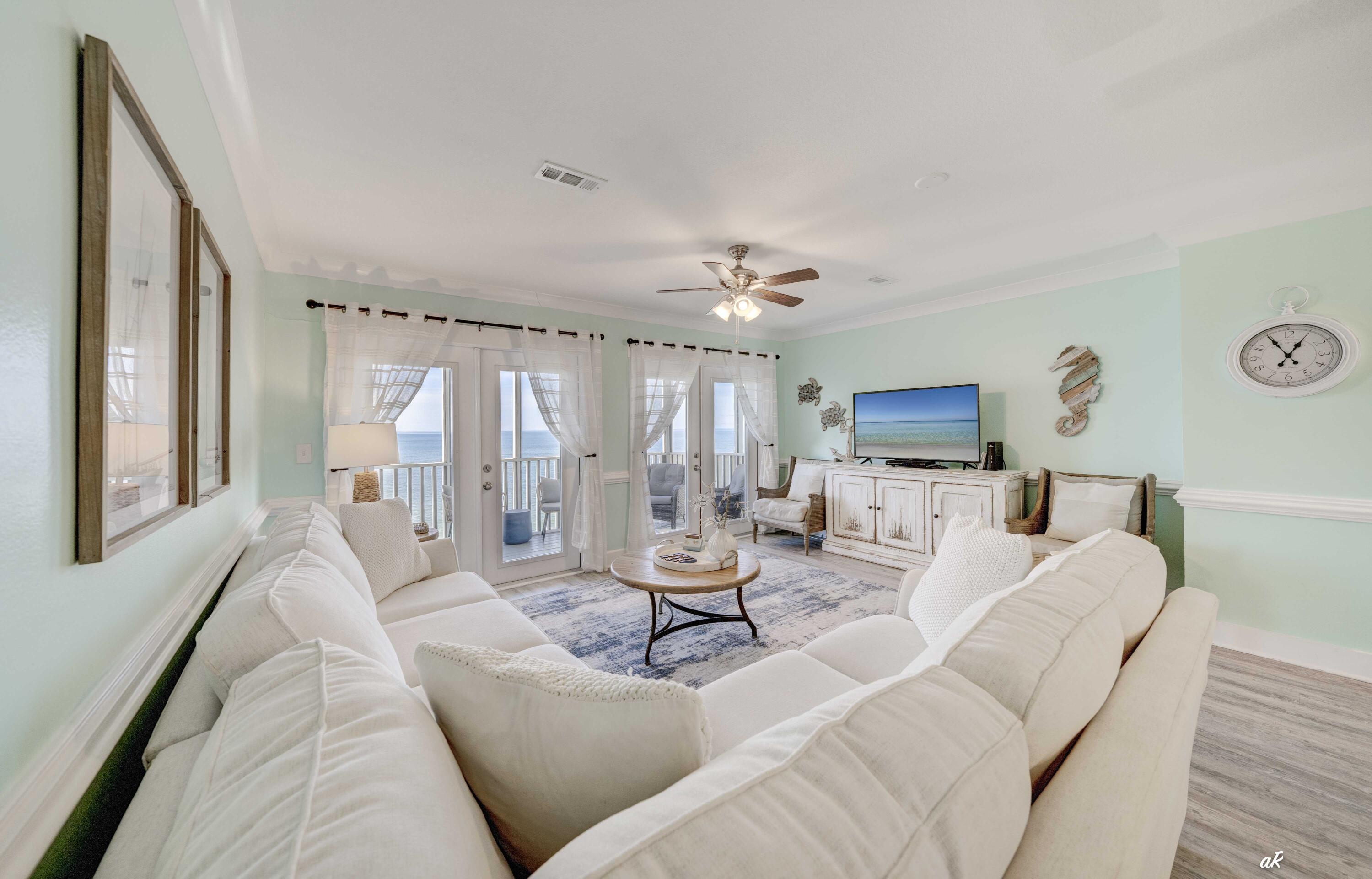 3869 Cape San Blas Road Port St. Joe, FL 32456 - Photo 12 of 52 a living room with furniture and a large window