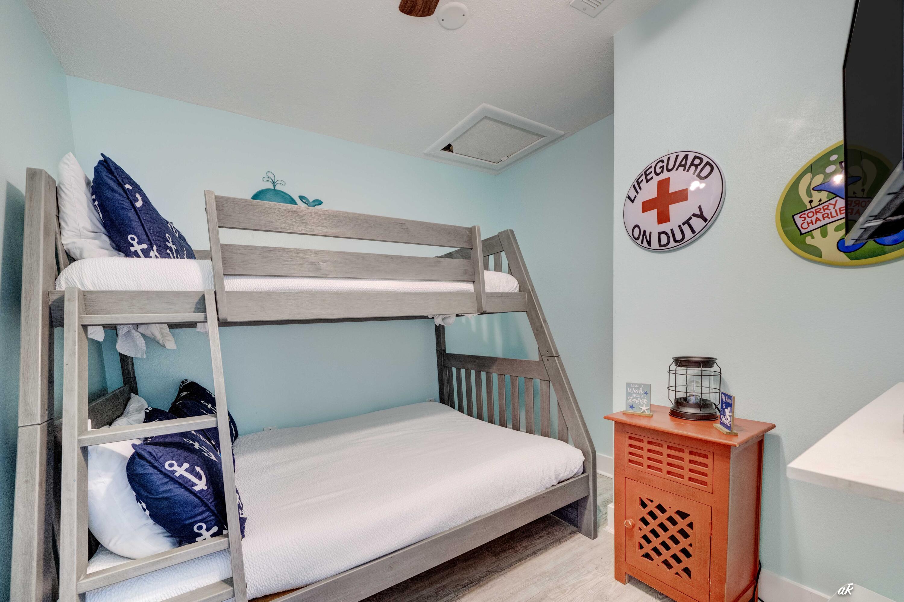 3869 Cape San Blas Road Port St. Joe, FL 32456 - Photo 28 of 52 a bedroom with a bed and a refrigerator