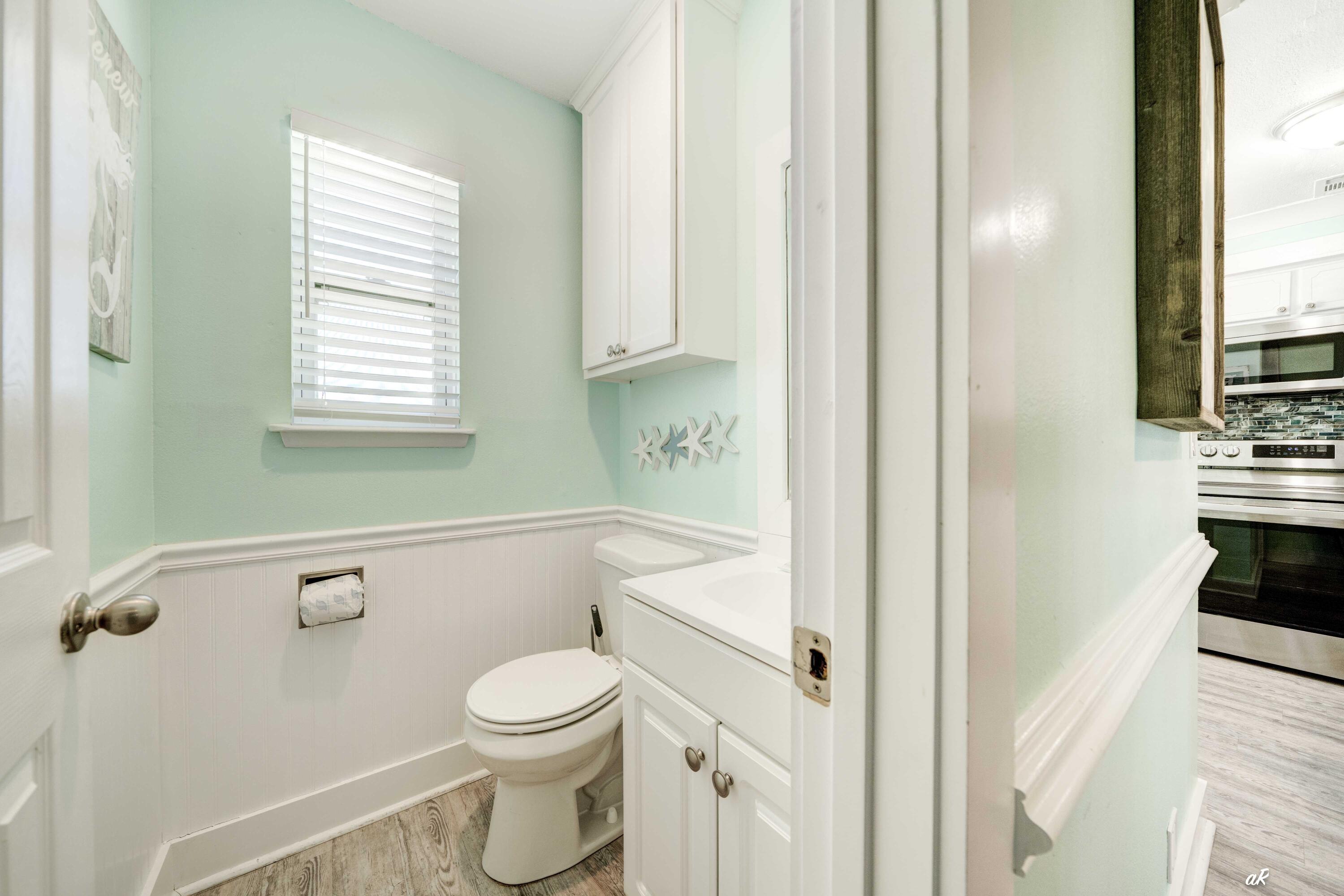 3869 Cape San Blas Road Port St. Joe, FL 32456 - Photo 31 of 52 a bathroom with a toilet a sink and a bathtub