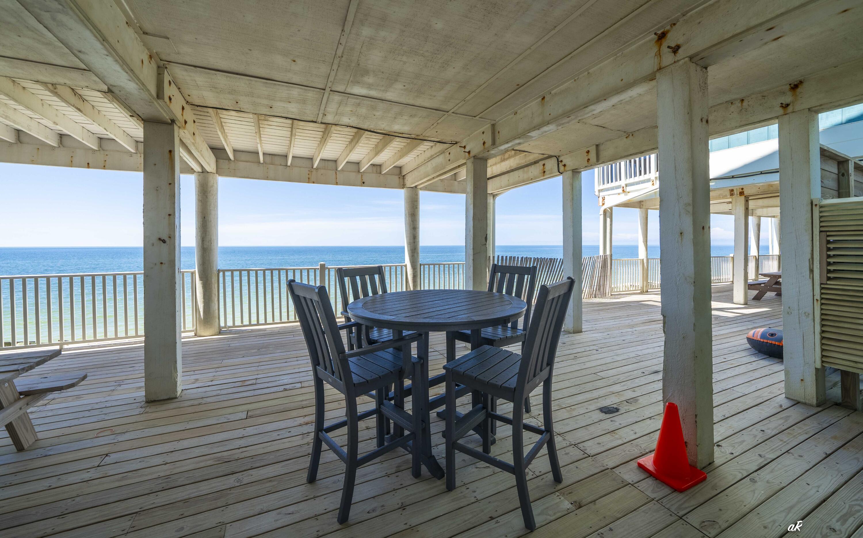 3869 Cape San Blas Road Port St. Joe, FL 32456 - Photo 34 of 52 a view of a dining room with furniture window and wooden floor