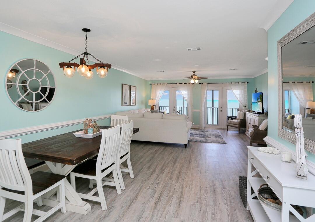 3869 Cape San Blas Road Port St. Joe, FL 32456 - Photo 44 of 52 a view of a dining room with furniture window and wooden floor