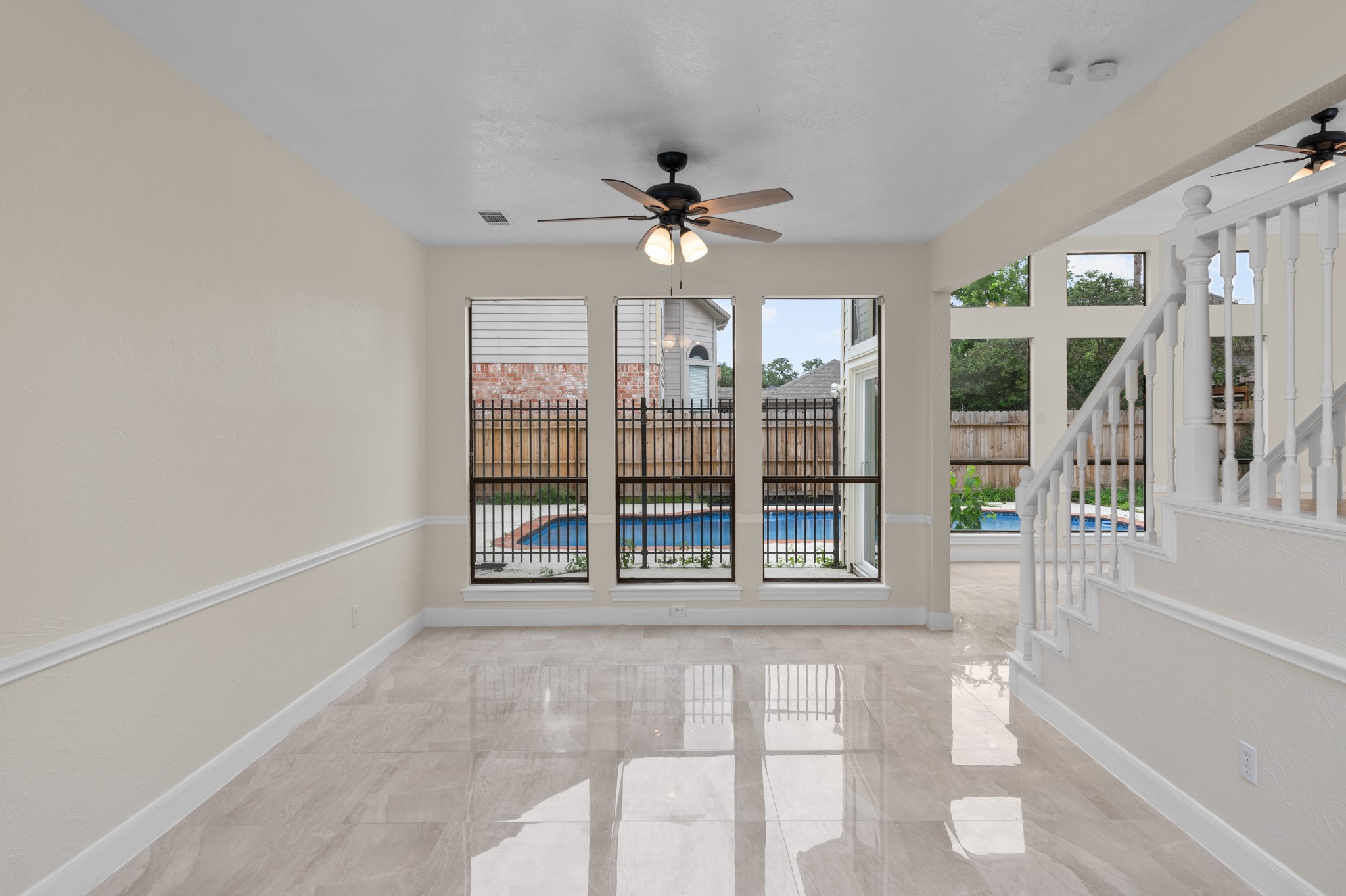 17402 Wilton Park Court Spring, TX 77379 - Photo 28 of 50 a view of a livingroom with a ceiling fan and window