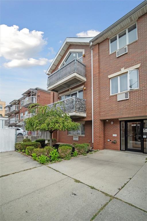 1523 74th Street, Unit 3F Brooklyn, NY 11228 - Photo 15 of 20 a front view of a building with a garden