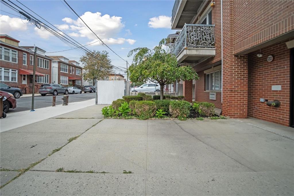 1523 74th Street, Unit 3F Brooklyn, NY 11228 - Photo 17 of 20 a couple of potted plants in front of brick building