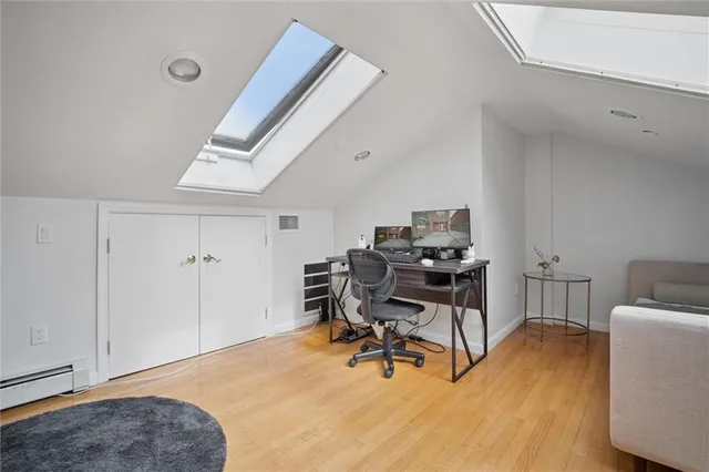 a workspace with furniture and a window