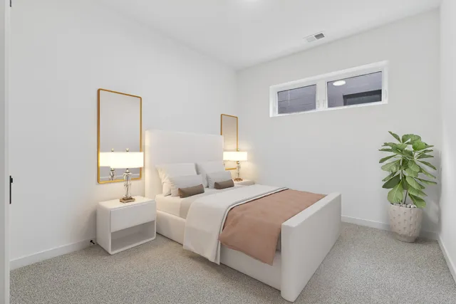 a bedroom with a bed and a couch