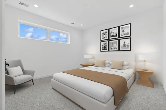 a bedroom with a bed and a couch