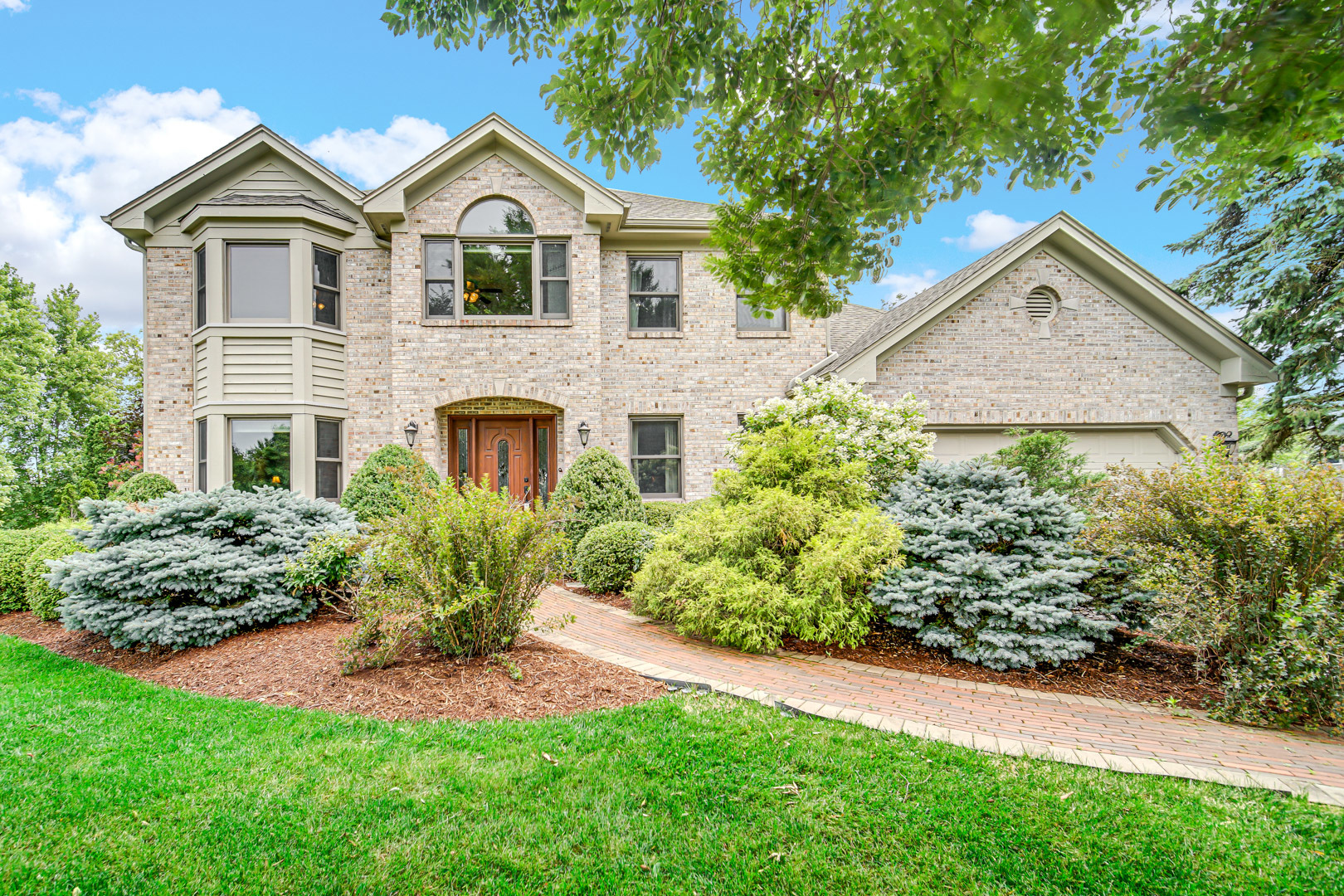 6 Red Hawk Drive Oswego, IL 60543 - Photo 1 of 41 a front view of a house with a yard and potted plants