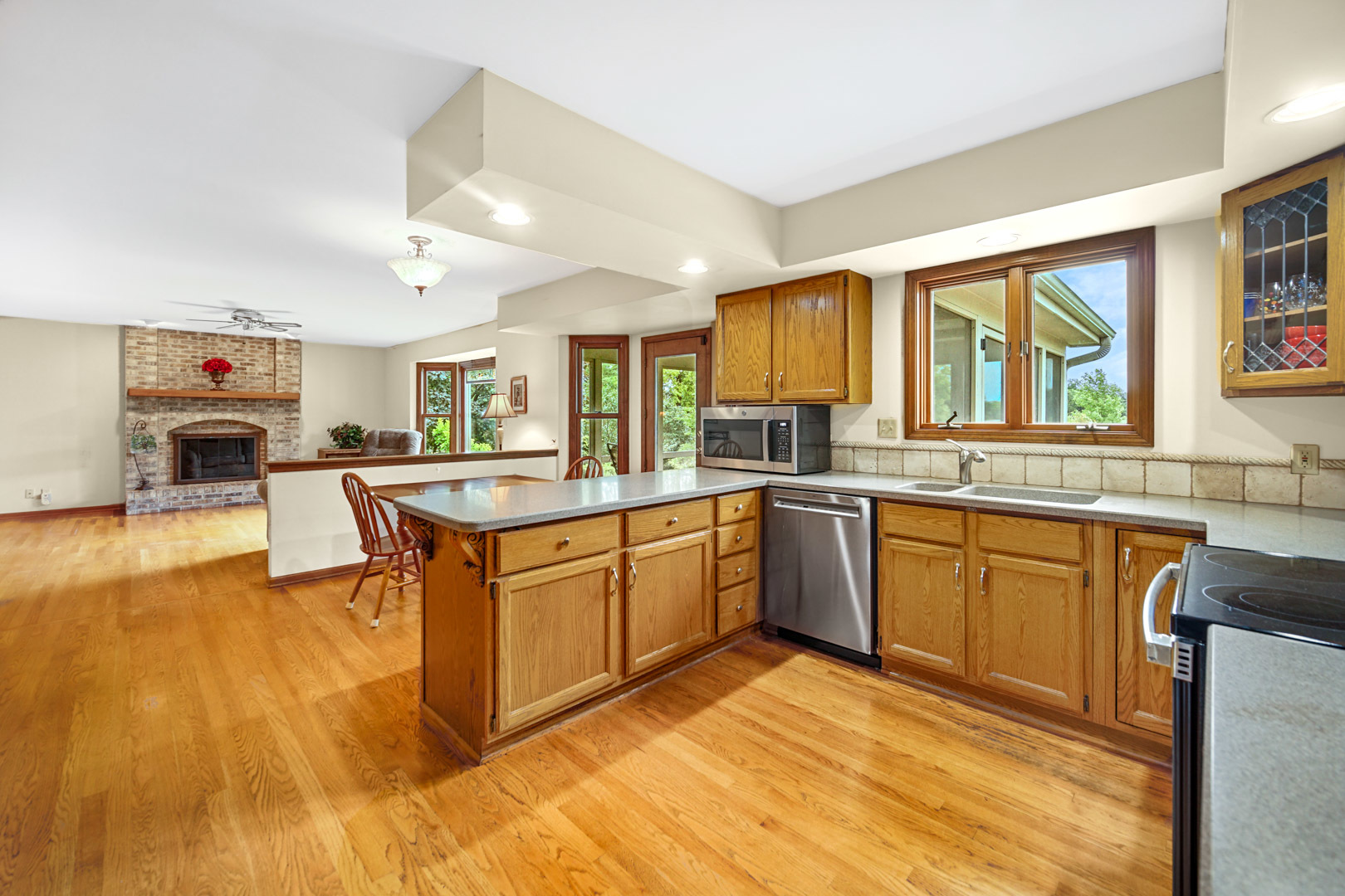 6 Red Hawk Drive Oswego, IL 60543 - Photo 11 of 41 a large kitchen with stainless steel appliances granite countertop a large center island and a sink
