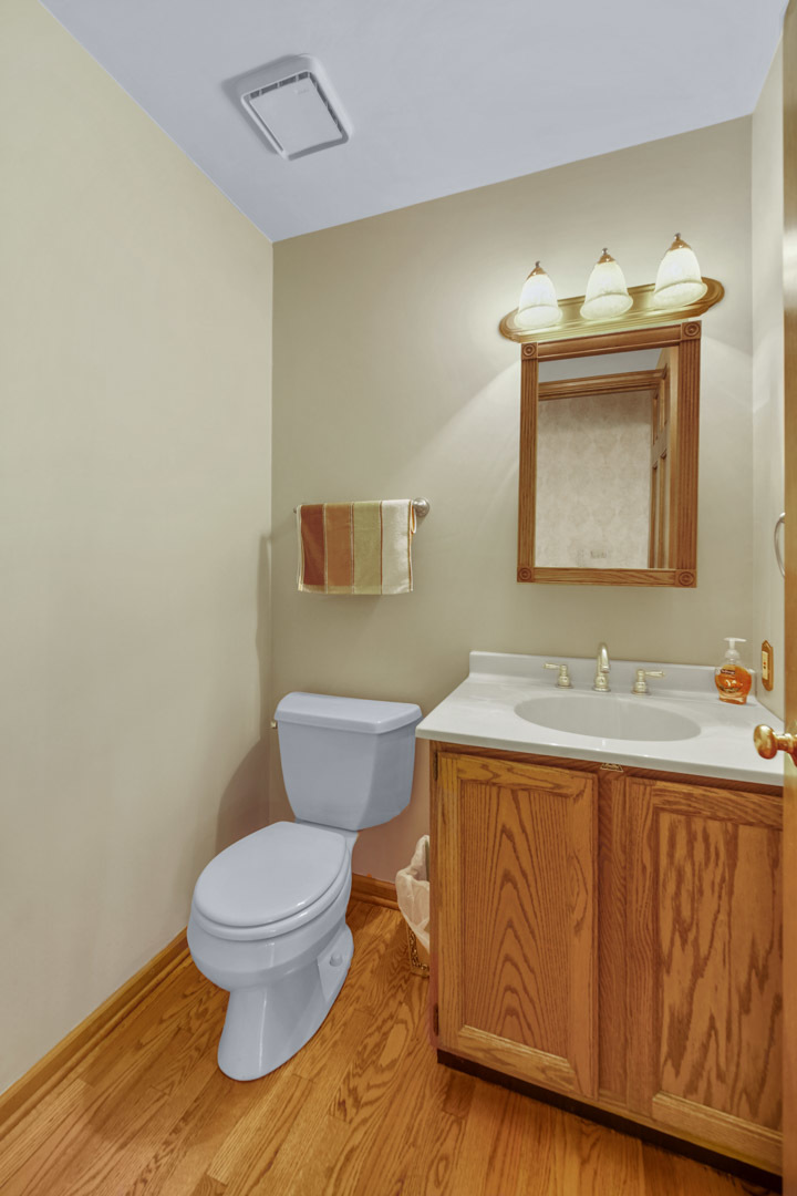 6 Red Hawk Drive Oswego, IL 60543 - Photo 16 of 41 a bathroom with a toilet a sink and mirror