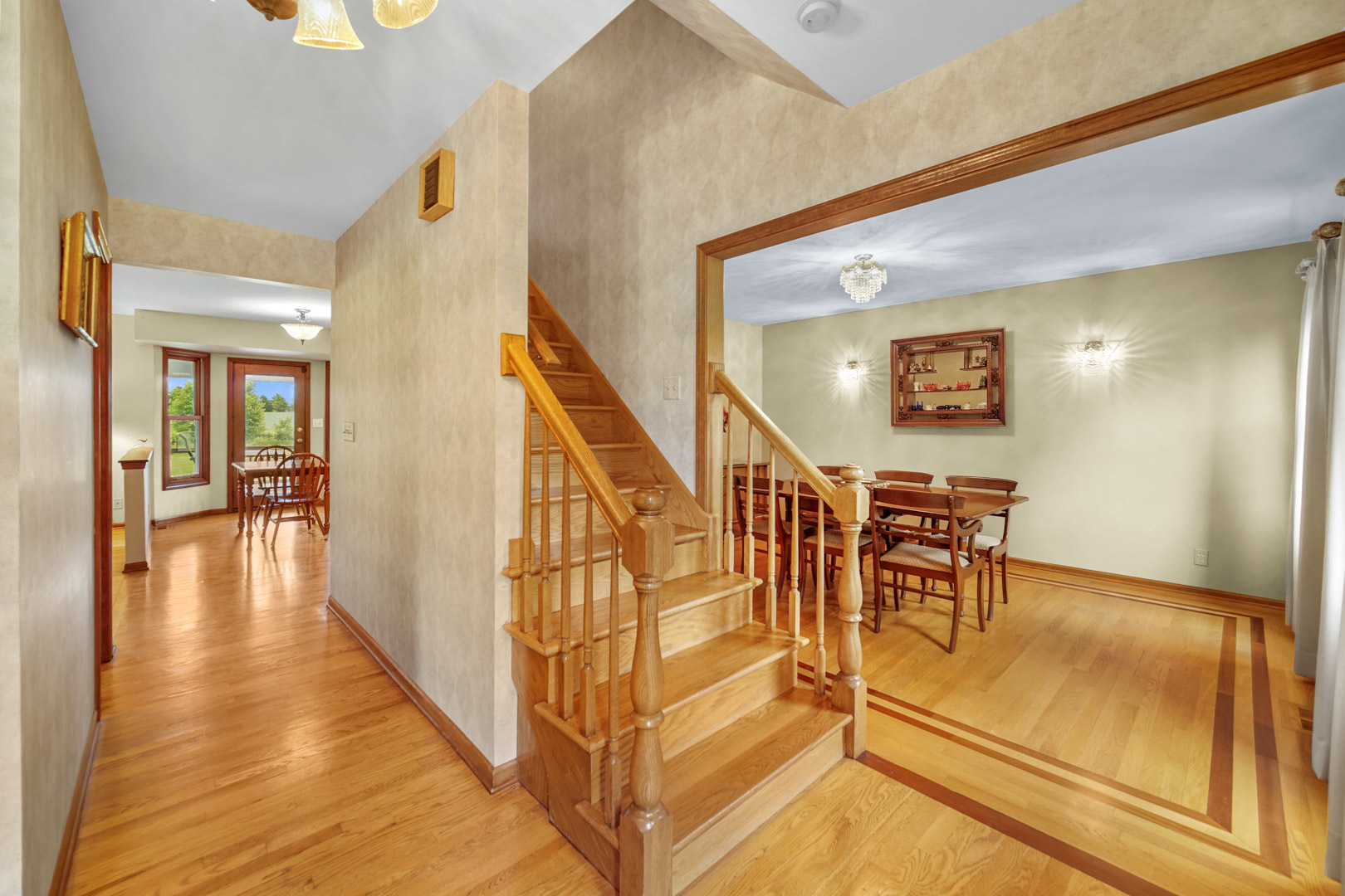 6 Red Hawk Drive Oswego, IL 60543 - Photo 2 of 41 a view of a hallway with wooden floor and staircase
