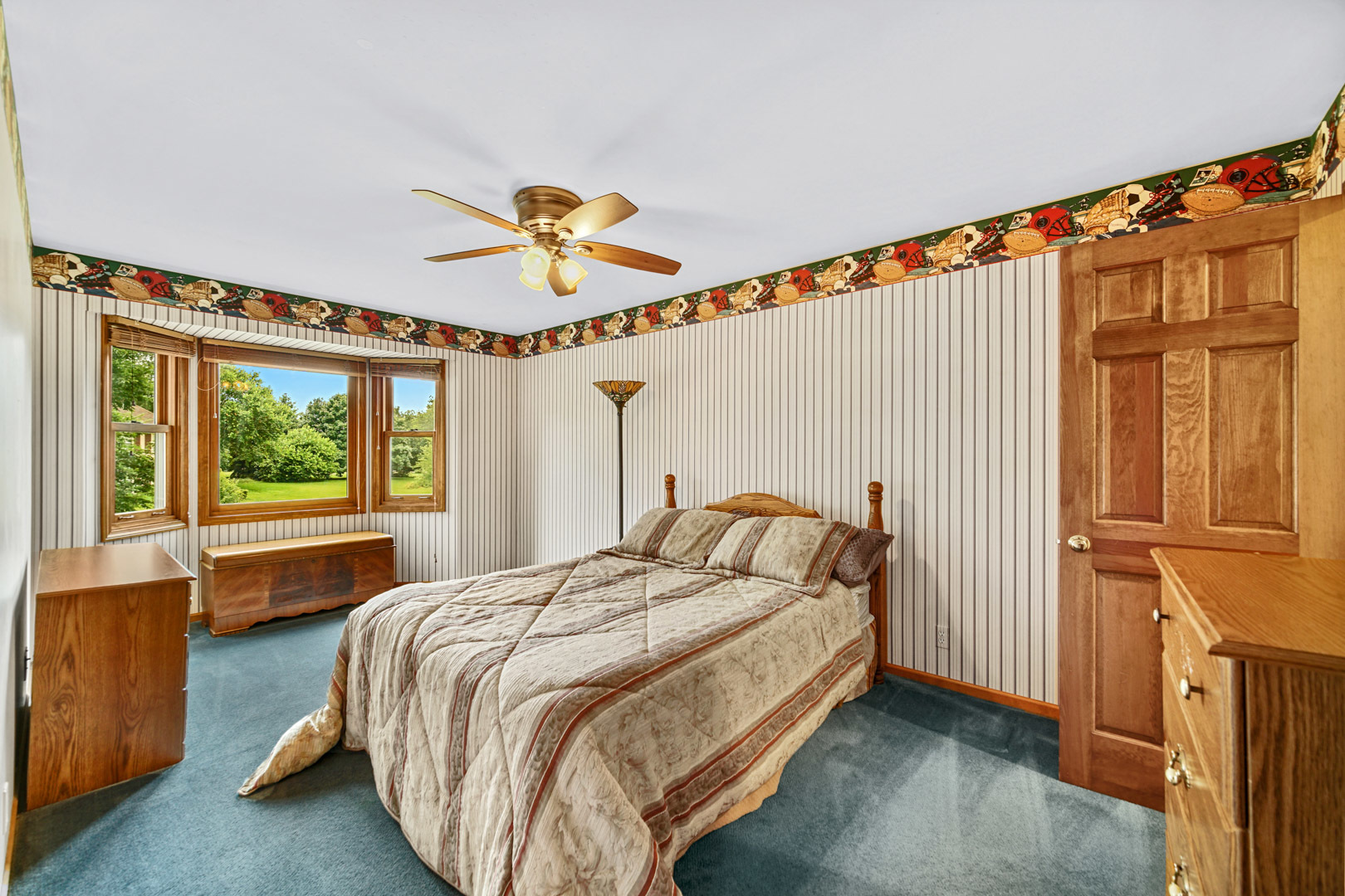 6 Red Hawk Drive Oswego, IL 60543 - Photo 23 of 41 a bedroom with a bed and a chandelier