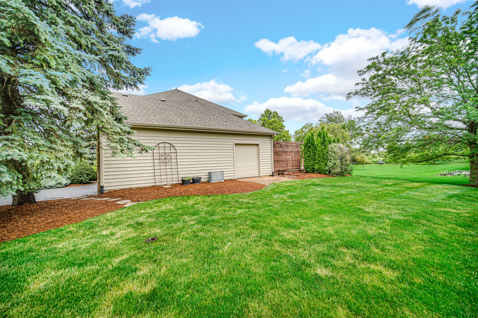 6 Red Hawk Drive Oswego, IL 60543 - Photo 39 of 41 a view of a backyard with a garden