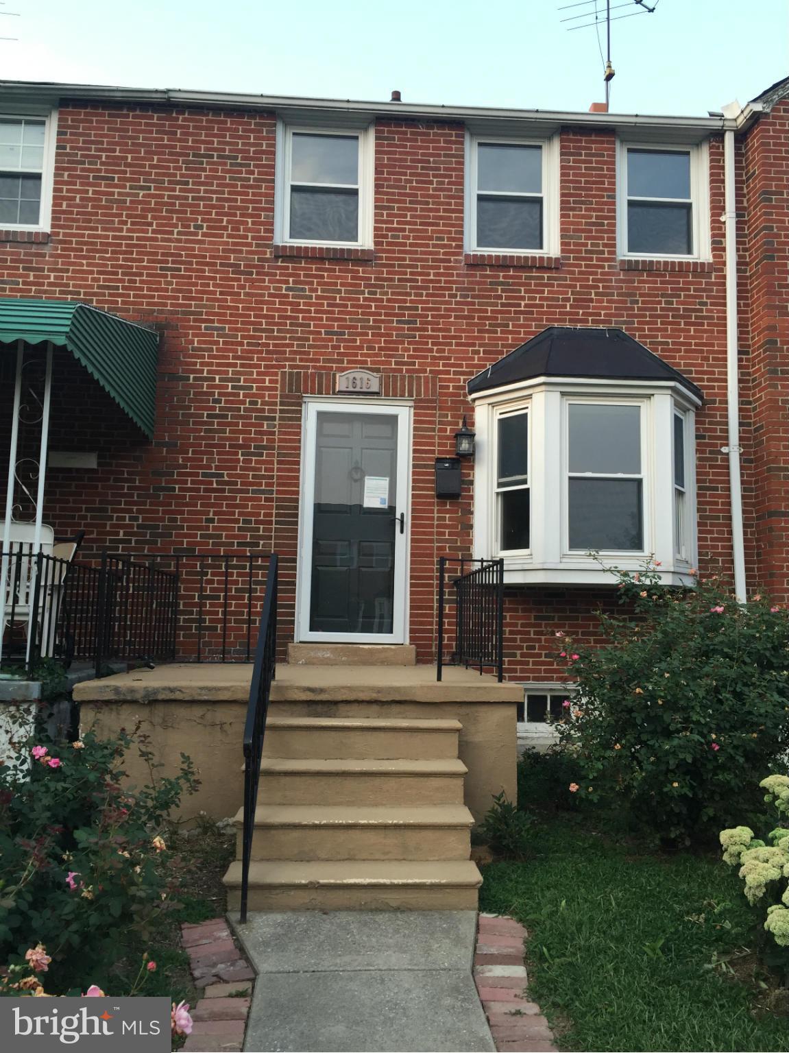 1616 Thetford Road Towson, MD 21286 - Photo 1 of 13 a front view of a house with a garden