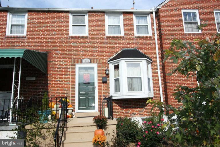 1616 Thetford Road Towson, MD 21286 - Photo 13 of 13 a front view of a house with a yard