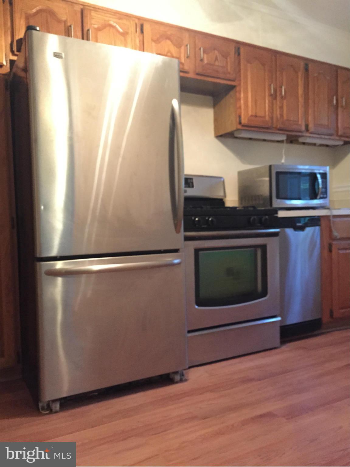 1616 Thetford Road Towson, MD 21286 - Photo 2 of 13 a kitchen with appliances and cabinets