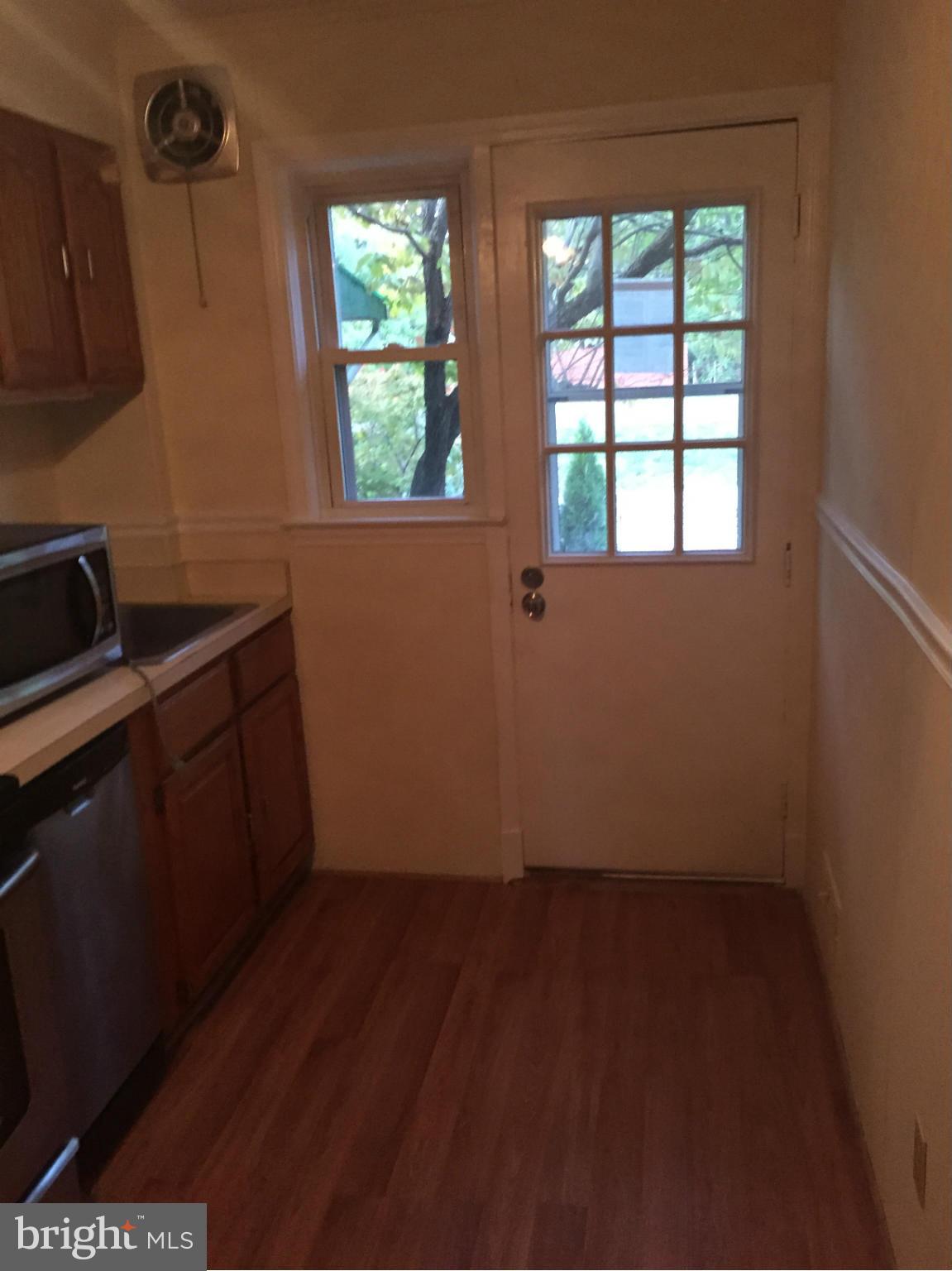 1616 Thetford Road Towson, MD 21286 - Photo 5 of 13 a room with wooden floor and windows