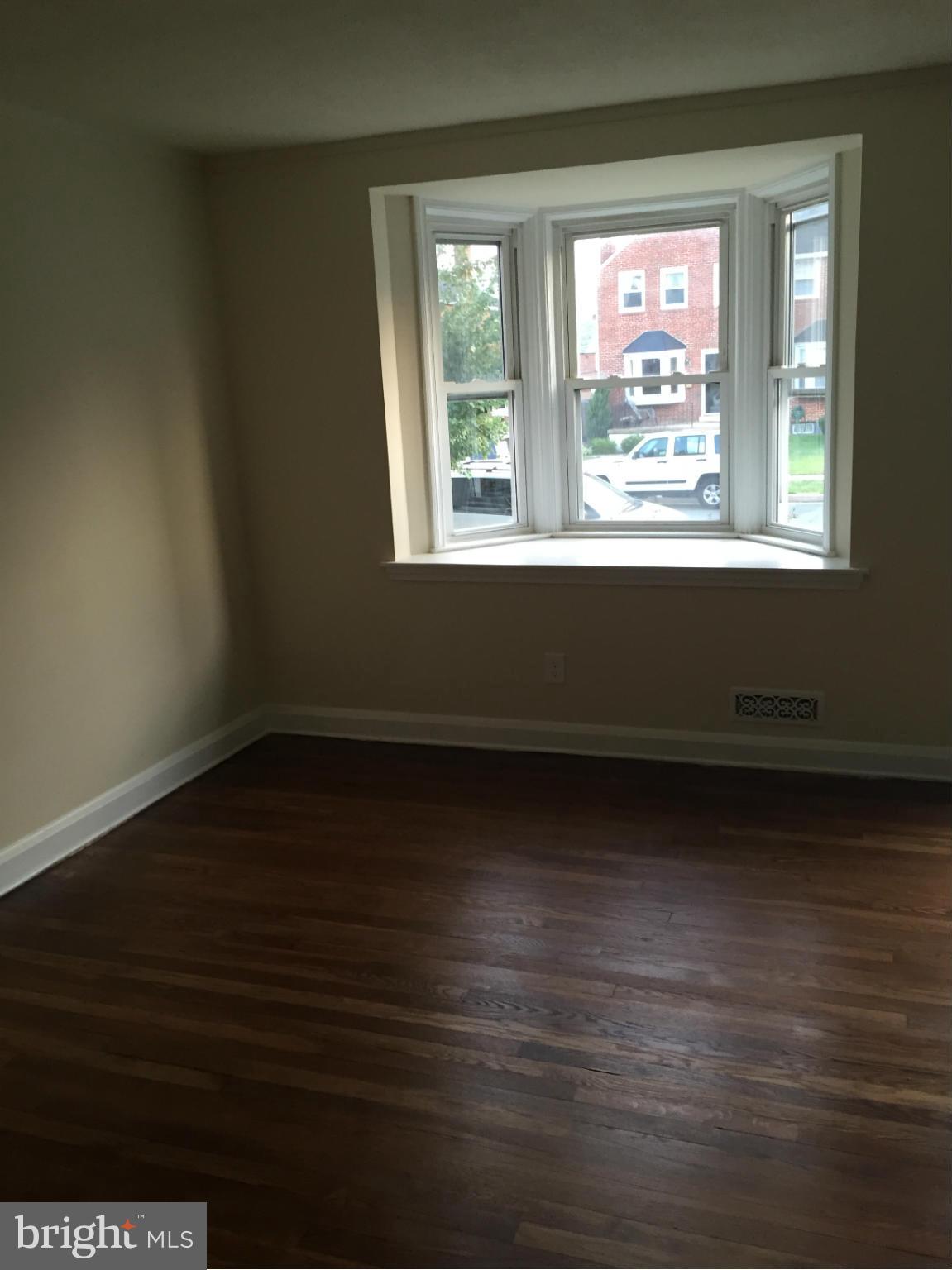 1616 Thetford Road Towson, MD 21286 - Photo 7 of 13 a view of room with window and wooden floor