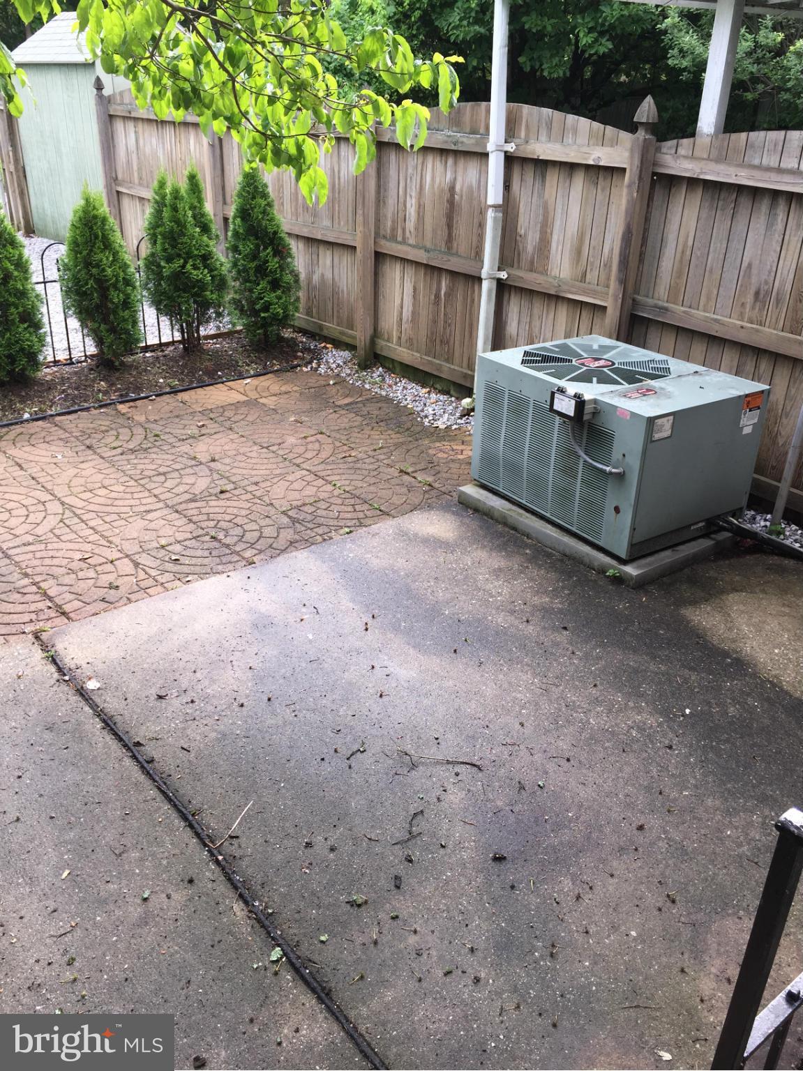 1616 Thetford Road Towson, MD 21286 - Photo 8 of 13 a view of a backyard with a small cabin and a chair