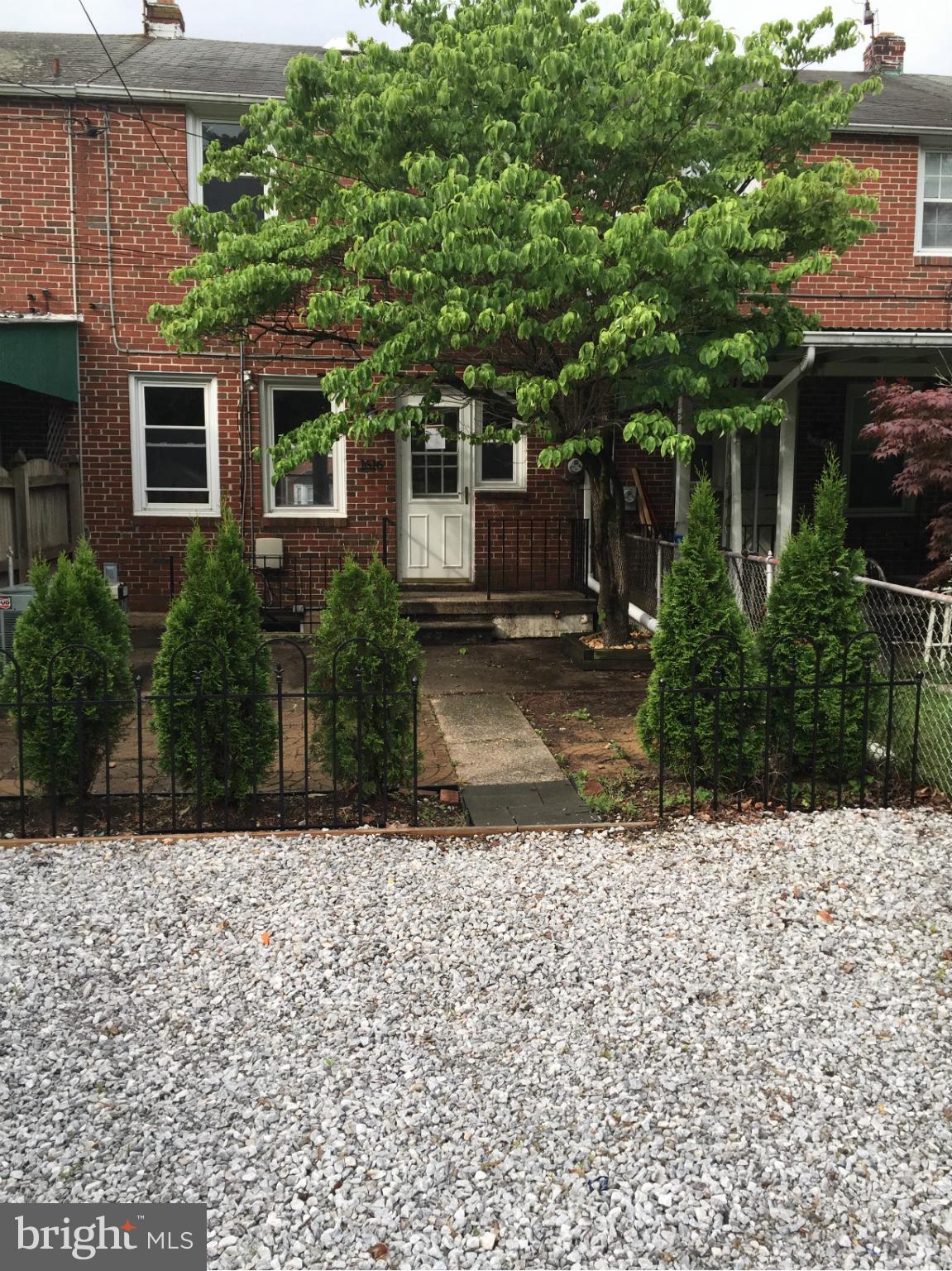 1616 Thetford Road Towson, MD 21286 - Photo 9 of 13 a front view of a house with a yard