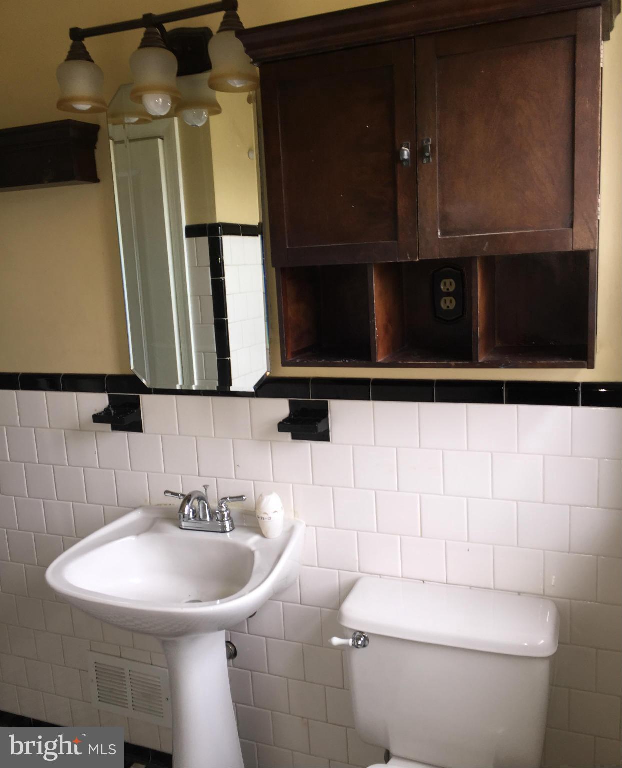 1616 Thetford Road Towson, MD 21286 - Photo 10 of 13 a bathroom with a sink a toilet and mirror