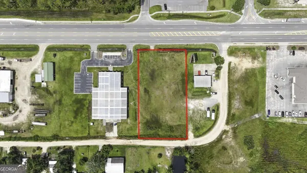 a view of swimming pool with lawn chairs and couches