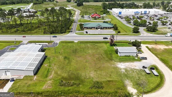 an aerial view of a pool patio fire pit and outdoor seating