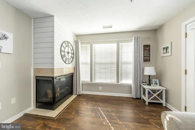 a view of a livingroom with furniture and a fireplace