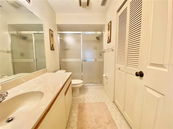 a bathroom with a tub and shower