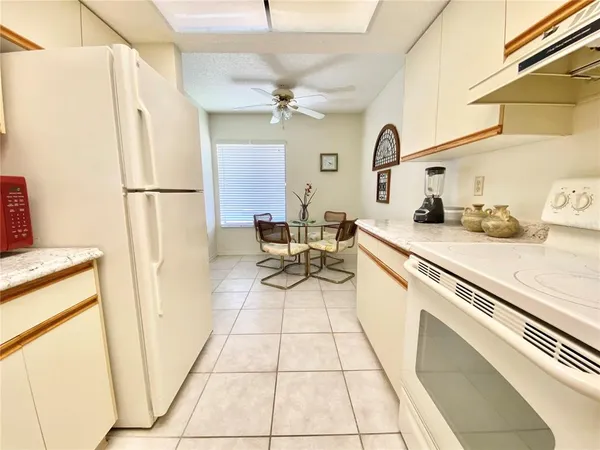 a kitchen with a sink appliances and cabinets