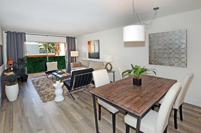 a view of a dining room with furniture window and wooden floor