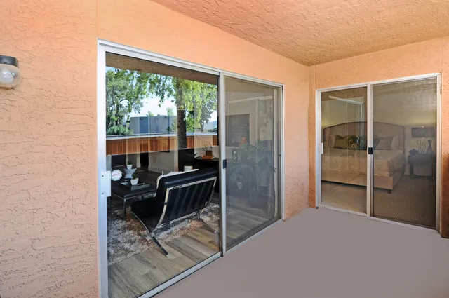 a bedroom with furniture and a window