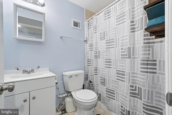 a bedroom with furniture and a flat screen tv