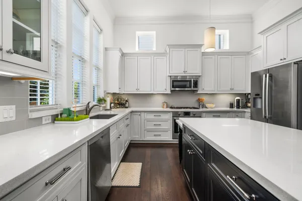 a kitchen with a white cabinets and white appliances