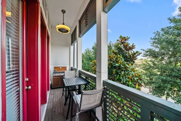 a view of a balcony with chairs