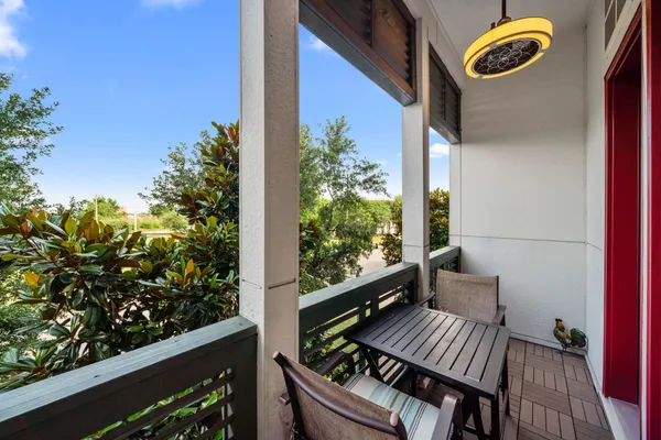 a view of a balcony with wooden floor
