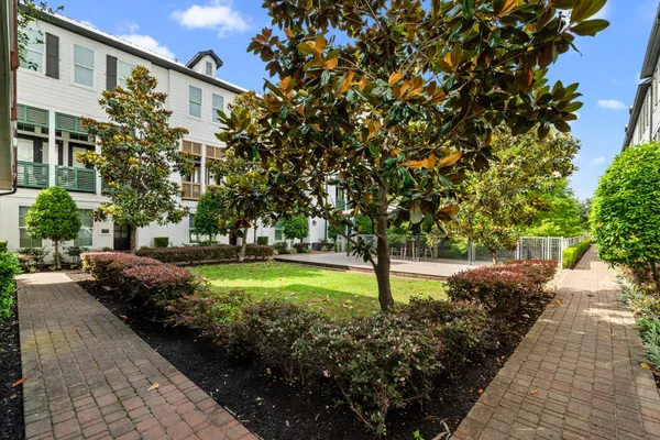 a view of a backyard with pathway