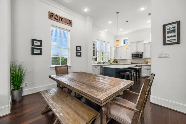 a view of a dining room with furniture and wooden floor