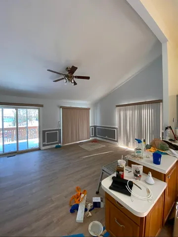 a room with furniture and a wooden floor