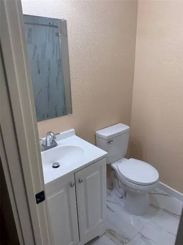 a bathroom with a sink and a toilet