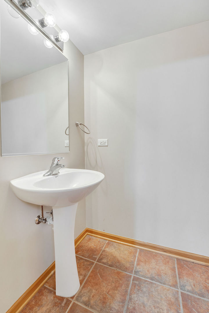 25281 Faraday Road Manhattan, IL 60442 - Photo 15 of 29 a sink and a mirror in a room