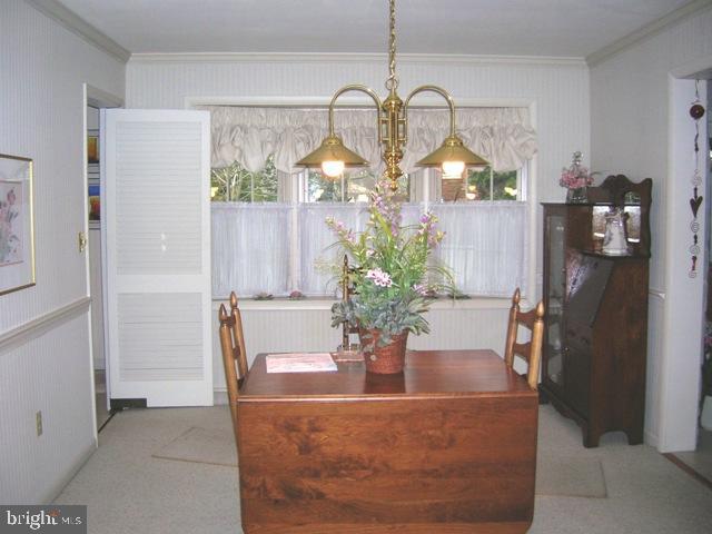 505 Bluebird Road Lititz, PA 17543 - Photo 5 of 14 a view of a dining room with a chandelier and wooden floor