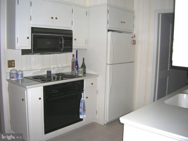 505 Bluebird Road Lititz, PA 17543 - Photo 9 of 14 a kitchen with a sink stove and refrigerator